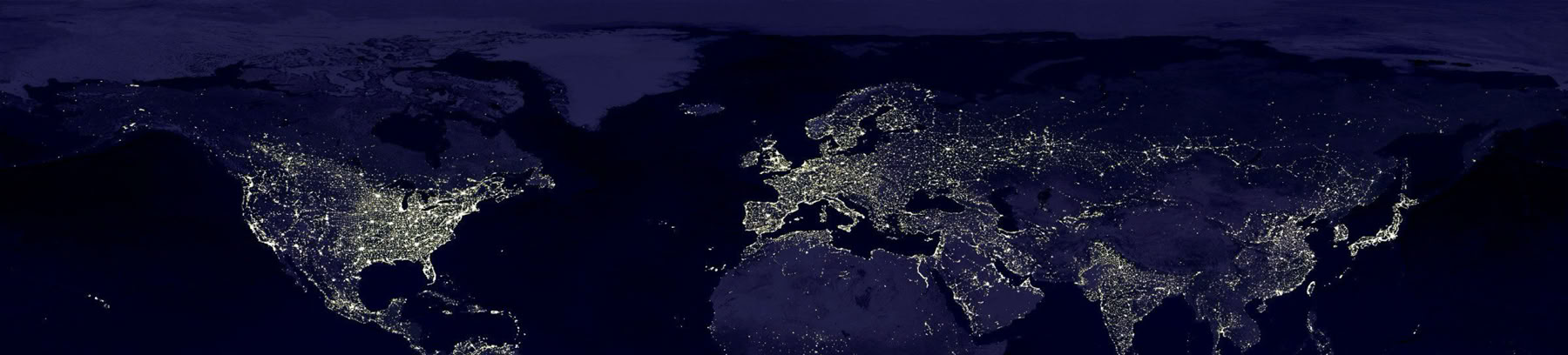 World map at night showing illuminated areas indicating populated regions.